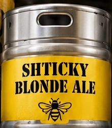 Silver keg with Kenmore Gold band reading Shticky Blonde Ale